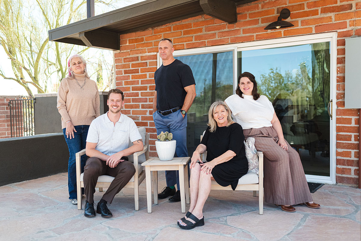 Desert Collective Real Estate Team Posing Outside of Tucson Home